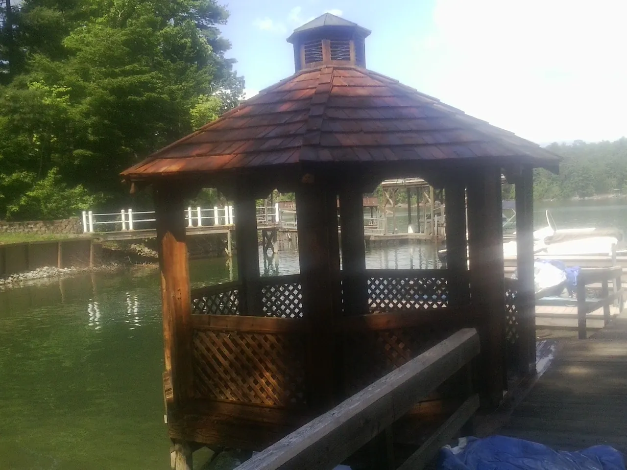 Cedar shake gazebo roof rebuilt on a lake dock in Alhambra